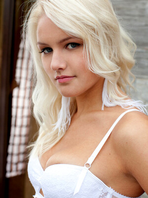 Karina O's beautiful blonde hair and stunning blue eyes accentuates her gorgeous body claid in dainty white lingerie.