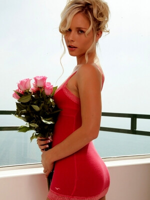 Glam babe Kara Duhe in her skimpy, pink dress on the terrace showing her pink panties